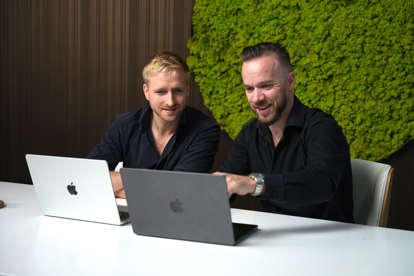 Lucas and Frederic at their laptops in the Amplifyre office